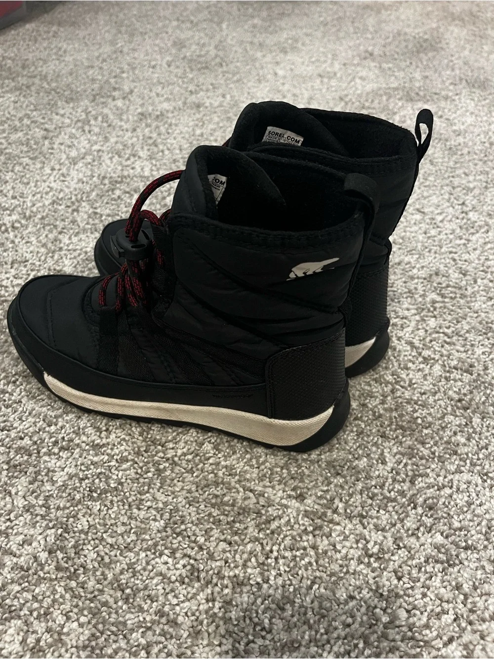 Sorel Kids Black Snow Boots with Red Lace Accents